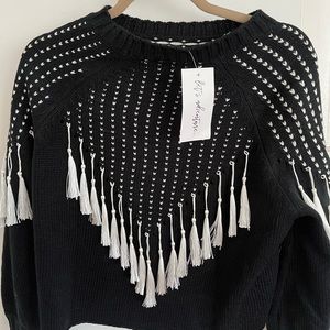 Cute crew neck cropped sweater with white tassles